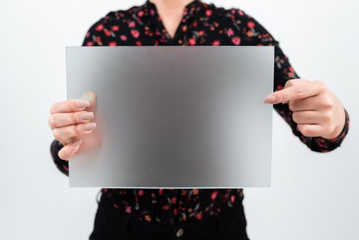 Woman Pointing At Placard And Presenting New Ideas For Marketing.