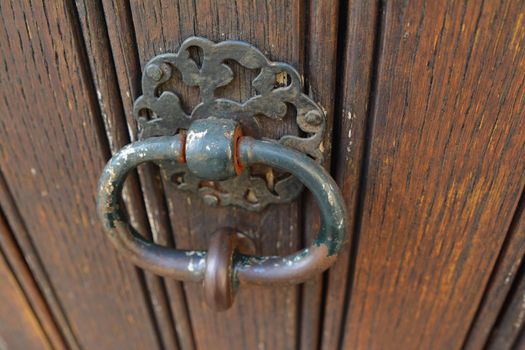 handle door rusty iron ring in wood doorway
