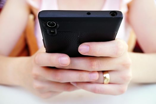 Smartphone in hand taking photos close up view