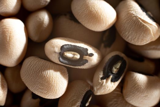 Beans bean black eyes bunch on a white background isolate. Gluten-free foods. Healthy eating. White cow peas beans on white. Top view