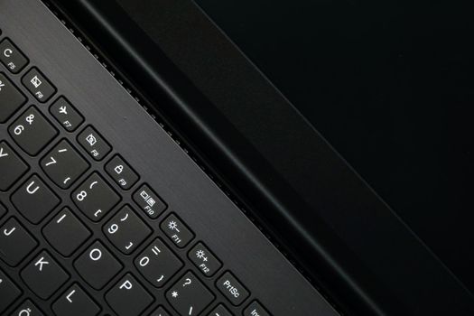 Laptop monitor and keyboard in triangle orientation asymmetric image