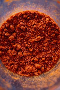 Powdered red pepper in the jar close up view