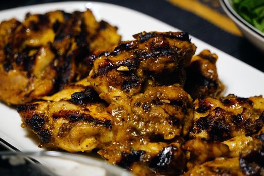Roasted chicken with appetizers cooked at home close up