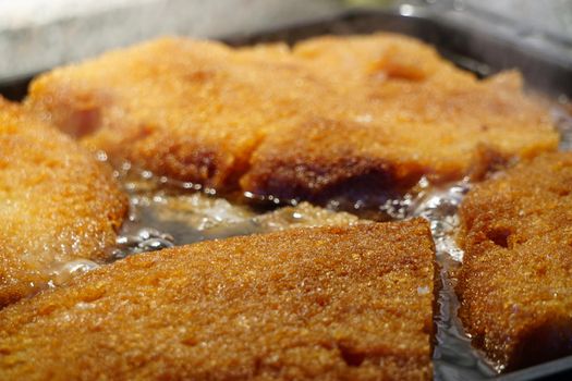 Crumpets in thick syrup Turkish dessert ekmek kadayifi