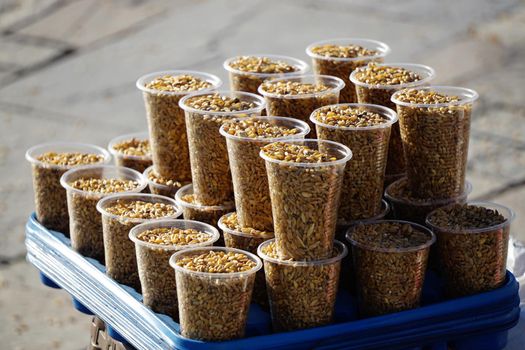 Bird seed stand in the park to feed the pigeons close up view