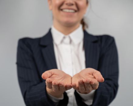 Close-up of caucasian woman holding her palms up