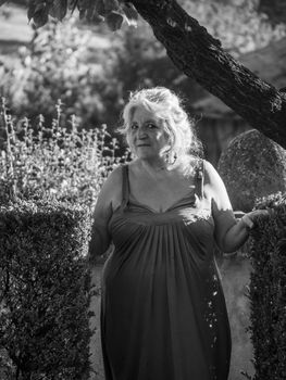 Portrait of beautiful senior Caucasian woman with grey hair l and outdoors