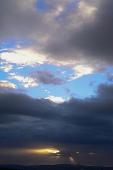 Dark sky clouds cloudscape over the sunset