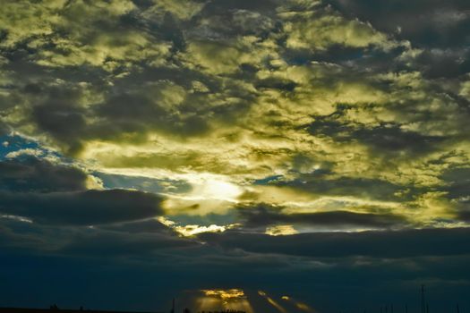 Dark sky clouds cloudscape over the sunset