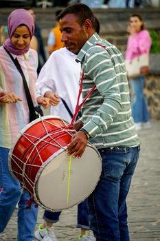 8 May 2022 Diyarbakir Turkey. People playing halay with drum and zurna on ten eyed bridge