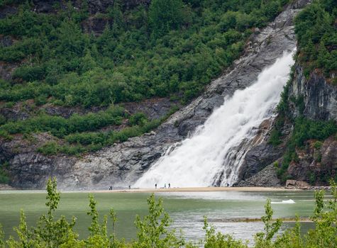Nugget Creek falls cascade into Mendenhall Lake close to Juneau in Alaska