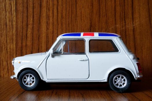 9 May 2021 Eskisehir Turkey White Austin Mini with Britain flag on top 1 24 diecast on wooden background