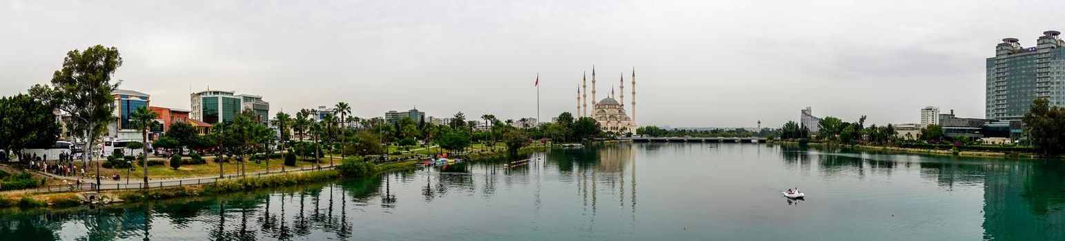 14 May 2022 Adana Turkey. Sabanci mosque and Seyhan river on a cloudy day