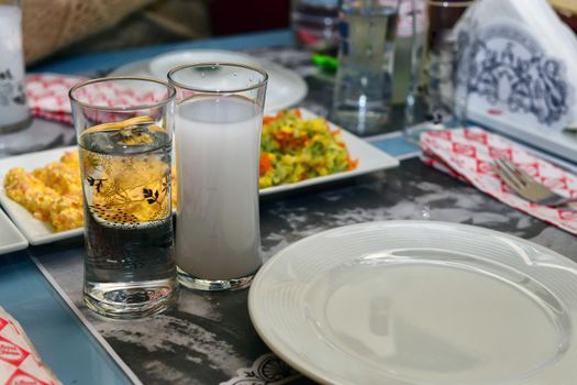 Turkish raki and appetizers close up view