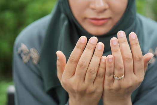 Close up of muslim women hand praying at ramadan .