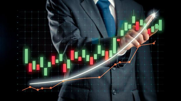 Businessman draw finance allusive graph chart showing business profit growth increasing to future target . Excellent financial status of corporate business rise up . Finance and money technology .