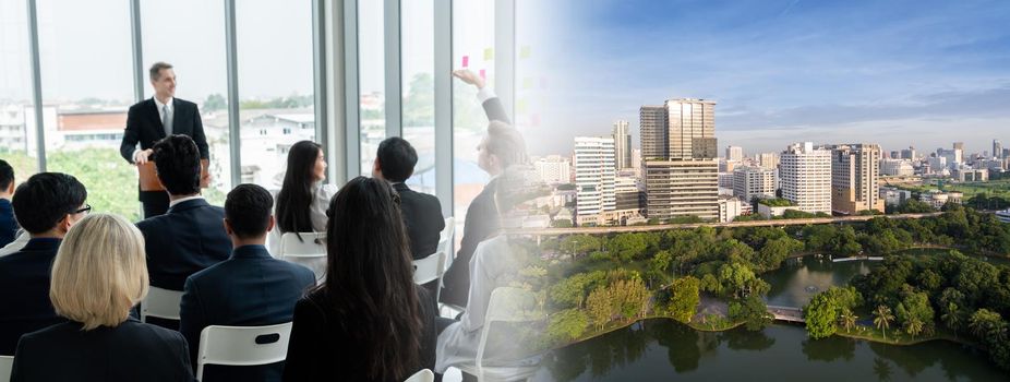 Group of business people meeting in a seminar conference widen view . Audience listening to instructor in employee education training session . Office worker community summit forum with speaker .