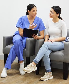 Consultation is key. a dentist and patient talking in a office