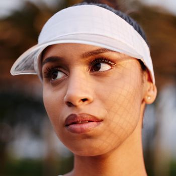I want people to see just how great I am. Closeup shot of a tennis player wearing a white visor