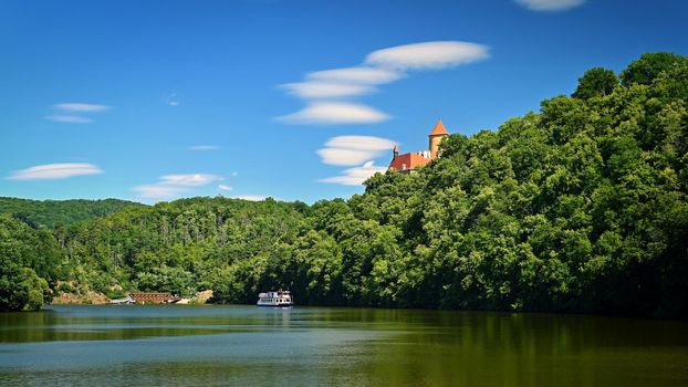 Beautiful old castle Veveri. Landscape with water on the Brno dam during summer holidays on a sunny day. Czech Republic - Brno. 
