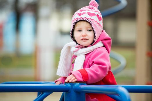 little girl playing on the playground