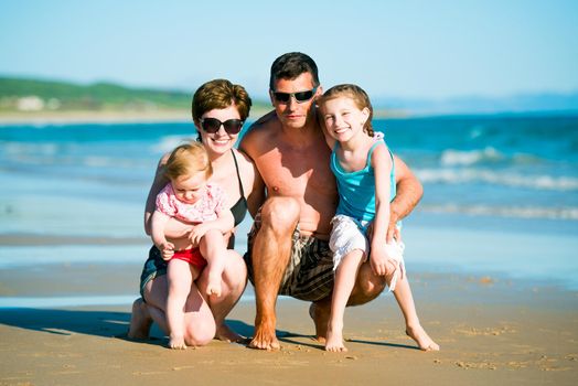 Family with two daughters at the beach