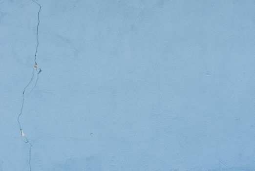 Abstract blue texture background. Surface of old damaged blue plaster.