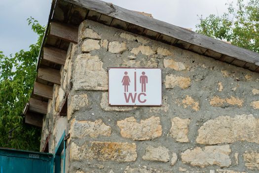 Sign door toilet heart stone old outdoor wood restroom outhouse, from nature tree in country and wc texture, beautiful home. Europe construction architecture,