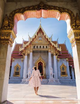 Wat Benchamabophit temple in Bangkok Thailand, The Marble temple in Bangkok. Asian woman with hat visiting temple in Bangkok