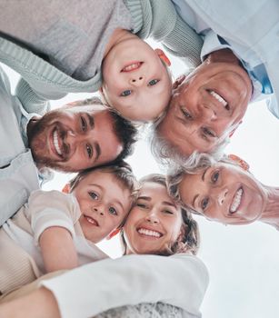 Like a circle, our love lasts forever. Low angle shot of a happy family huddled together