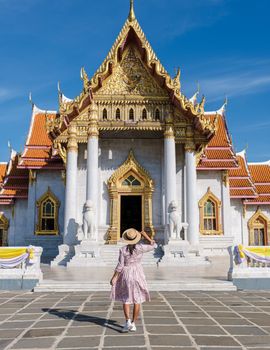 Wat Benchamabophit temple in Bangkok Thailand, The Marble temple in Bangkok. Asian woman with hat visiting temple in Bangkok