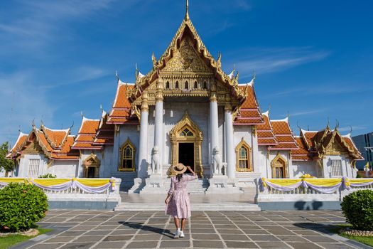 Wat Benchamabophit temple in Bangkok Thailand, The Marble temple in Bangkok. Asian woman with hat visiting temple in Bangkok