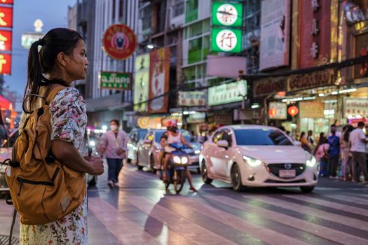 China town Bangkok Thailand, colorful streets of China Town Bangkok.Asian woman with bag, tourist visiting Chinatown