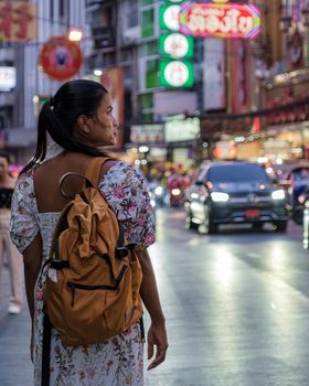 China town Bangkok Thailand, colorful streets of China Town Bangkok.Asian woman with bag, tourist visiting Chinatown