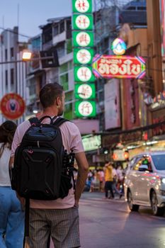 China town Bangkok Thailand, colorful streets of China Town Bangkok.European men with bag, tourist visiting Chinatown