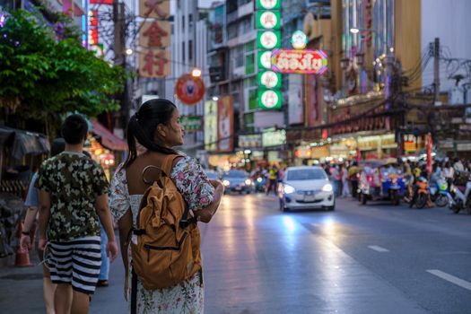 China town Bangkok Thailand, colorful streets of China Town Bangkok.Asian woman with bag, tourist visiting Chinatown