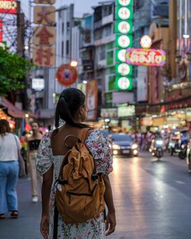 China town Bangkok Thailand, colorful streets of China Town Bangkok.Asian woman with bag, tourist visiting Chinatown