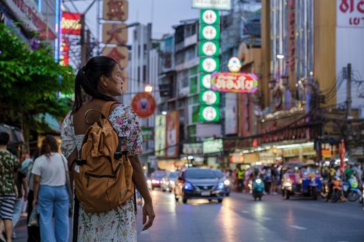 China town Bangkok Thailand, colorful streets of China Town Bangkok.Asian woman with bag, tourist visiting Chinatown