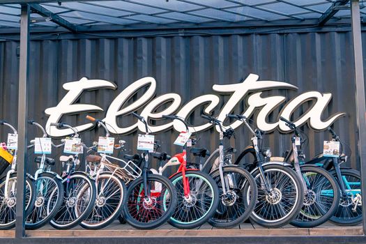 SAINT PETERSBURG, RUSSIA - JUNE 30, 2022: A number of beautiful stylish Electra bicycles for sale in a trendy modern bike shop. bicycle accessories, bike purchase, cycling culture