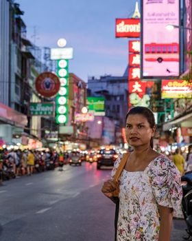 China town Bangkok Thailand, colorful streets of China Town Bangkok.Asian woman with bag, tourist visiting Chinatown