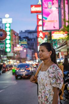 China town Bangkok Thailand, colorful streets of China Town Bangkok.Asian woman with bag, tourist visiting Chinatown