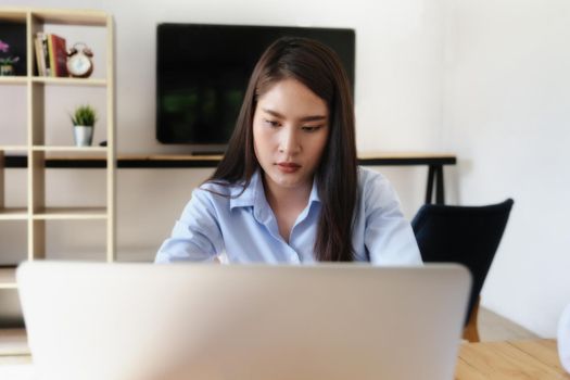 A company employee shows a bored expression on his or her job while working in the office