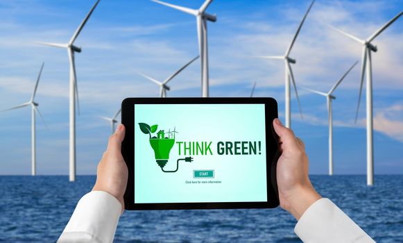 Green business transformation for environment saving and ESG business concept. Businessman using tablet to set corporate goal toward environmental friendly management and alternative clean energy use.