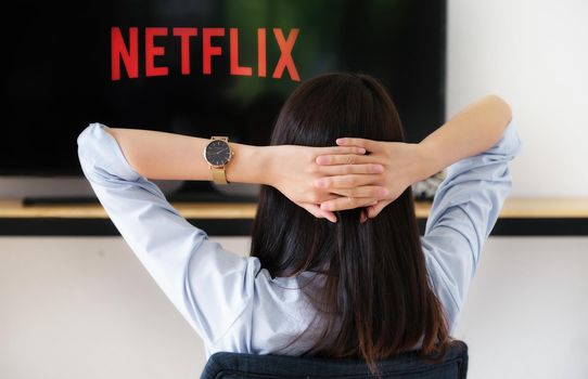 Chiang mai Thailand, 2020 June 07 - A young woman watches Netflix on his TV and at home