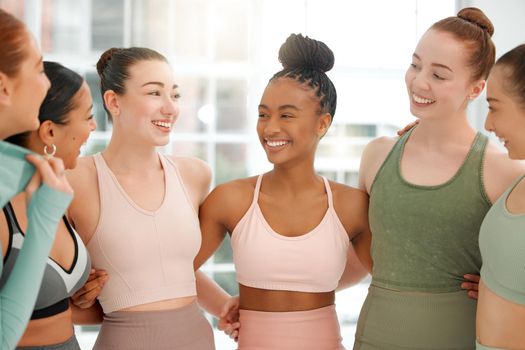 We come to exercise but stay to socialise. a group women standing together in their workout clothes