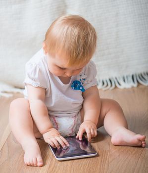 adorable baby with tablet PC