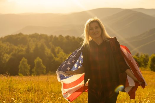 young beautiful woman holding USA flag