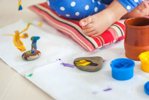 toddler paints with gouache. High quality photo