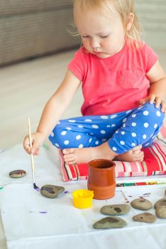 toddler paints with gouache. High quality photo