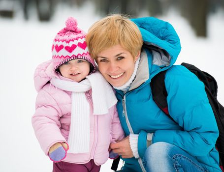 Beautiful Mother and child on a winter walk